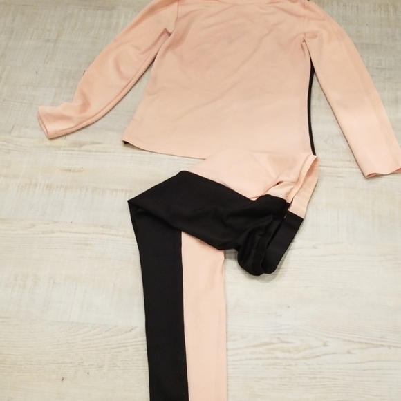 black and pink tracksuit